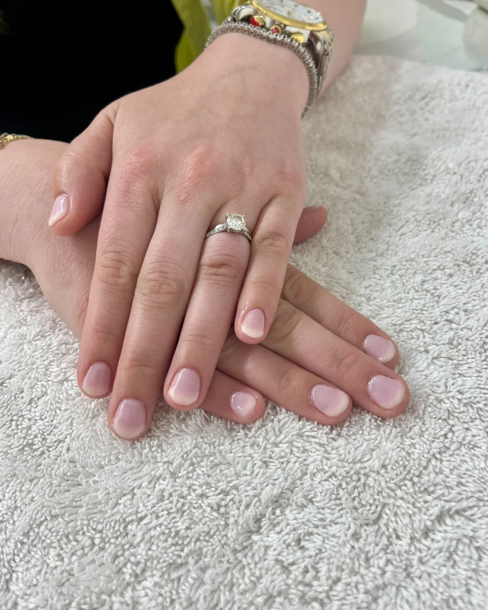 Sheer pink gel nails on a client