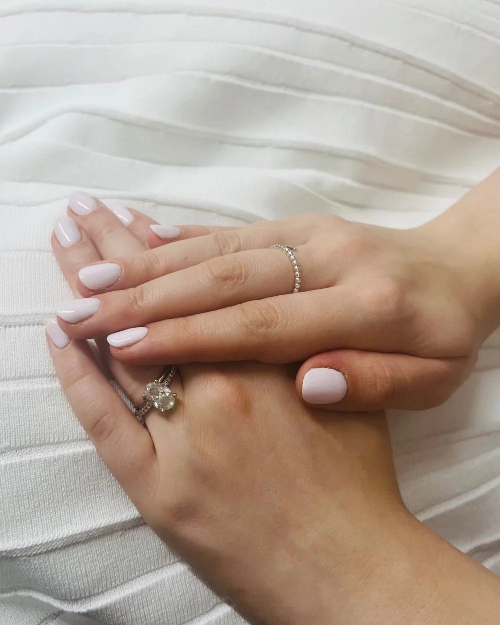 White gel nails on a client