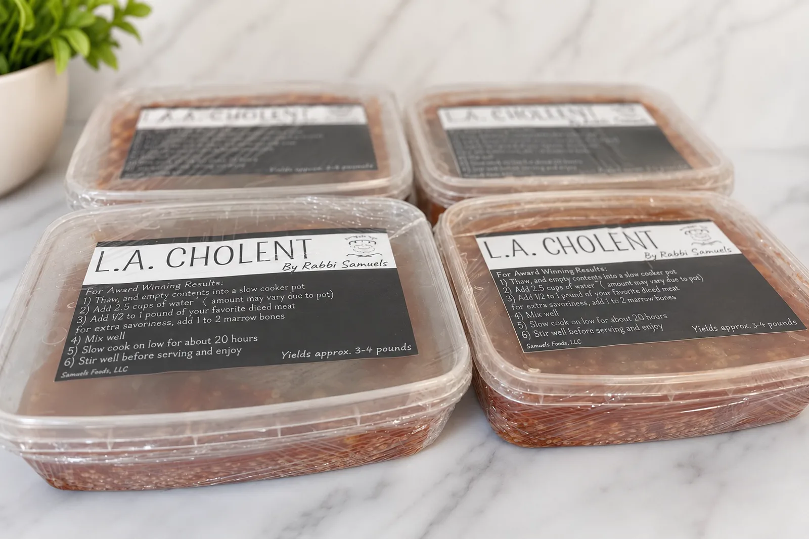 Four sealed tubs of L.A. Cholent on white marble, each labelled L.A. Cholent by Rabbi Samuels with the cooking steps.