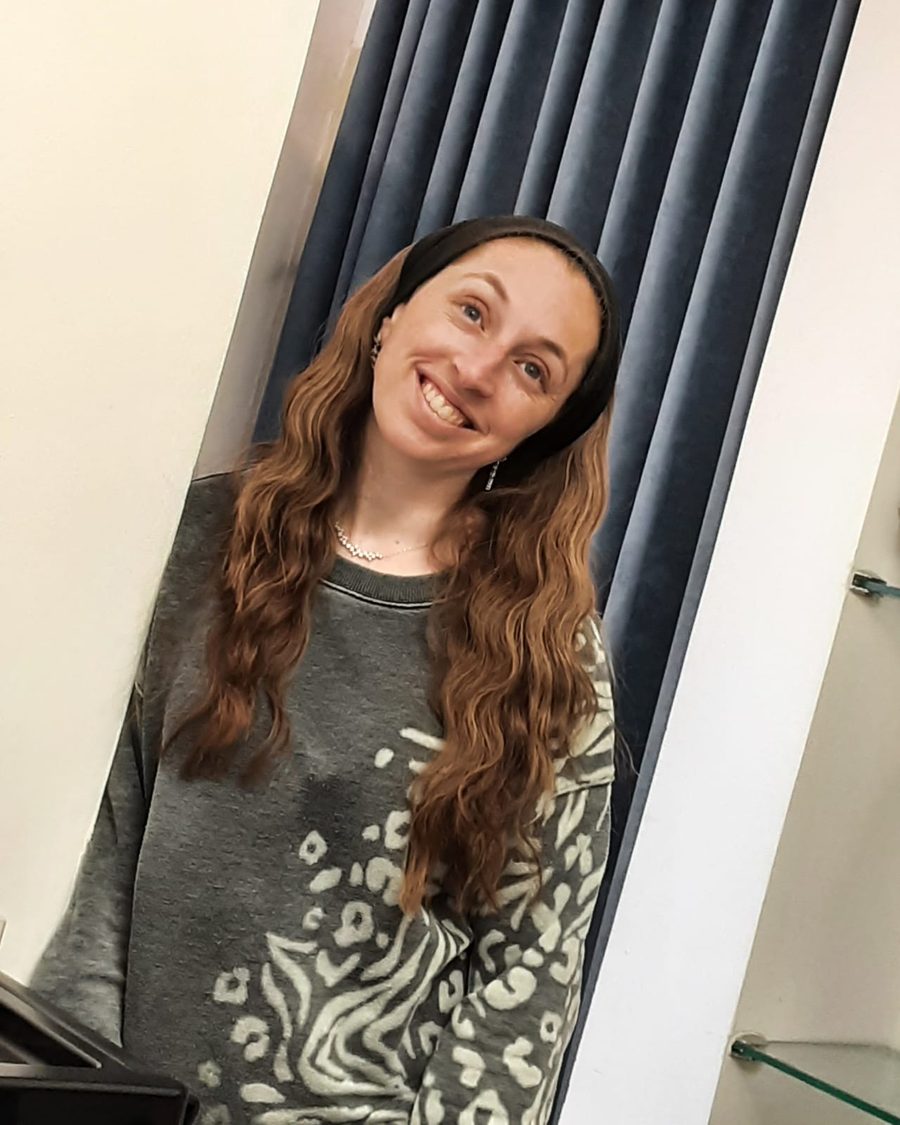 Michal Simkin, smiling, long wavy hair