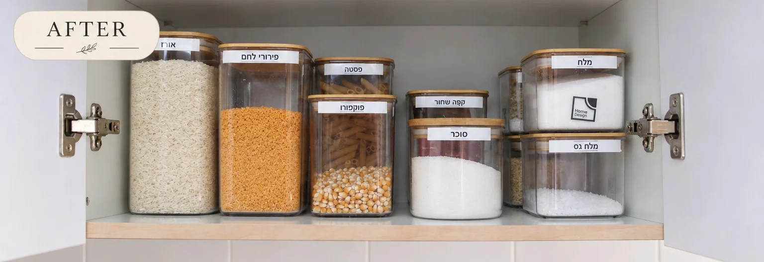 A kitchen cupboard shelf with labelled jars in rows