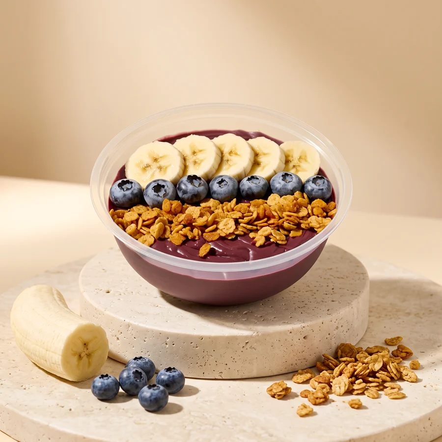 A Classic bowl: banana, frozen blueberries and super granola on our acai base