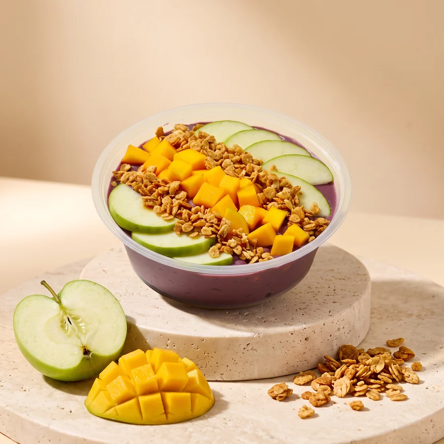 A Sunrise bowl: green apple, frozen mango and super granola on our acai base